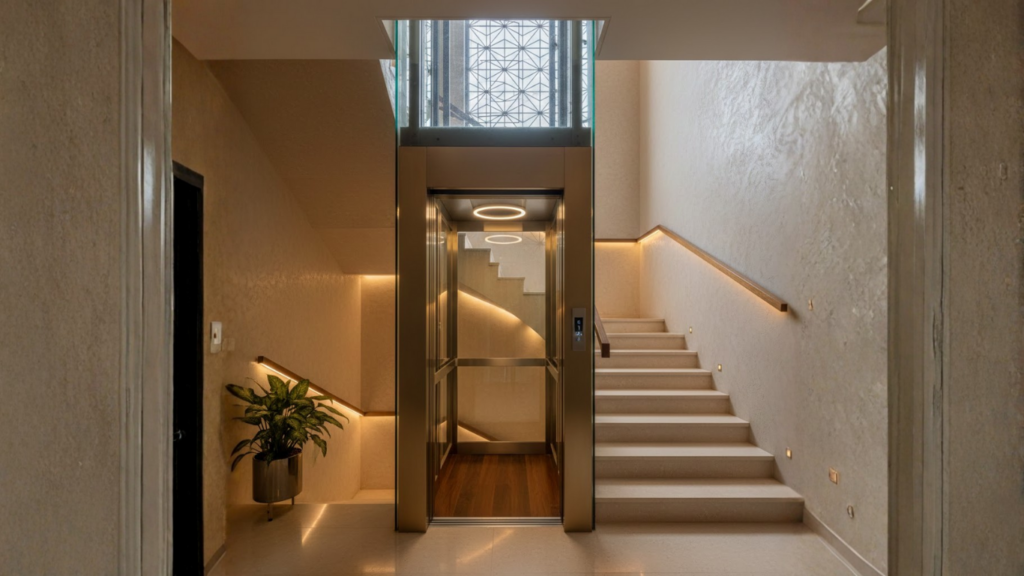 A compact home elevator installed in a tight space or staircase void inside an Indian home - How Home Elevators Improve Daily Life